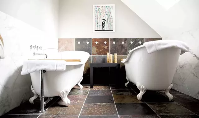 Bathroom with double clawfoot tubs - COURTESY OF THE WOODSTOCKER B&B