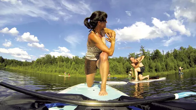A paddleboard yoga class on Blueberry Lake - COURTESY OF CLEARWATER SPORTS
