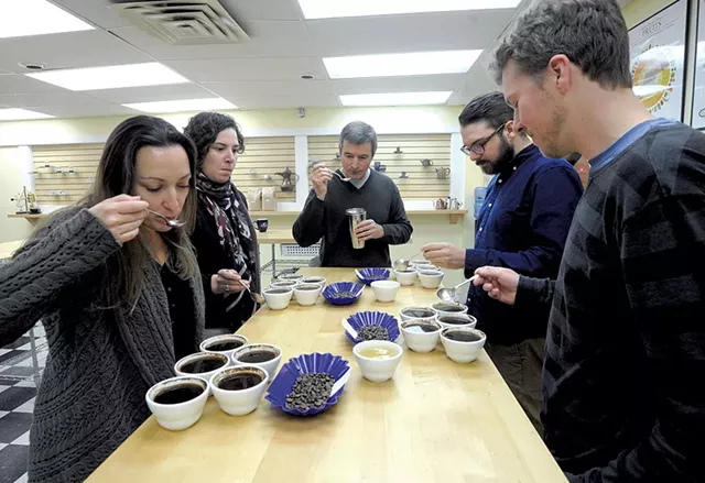 Coffee Lab International staff Shannon Cheney, Debby Pakbaz, Mané Alves, Maxwell Duquette and Josh Parker cupping coffee - JEB WALLACE-BRODEUR