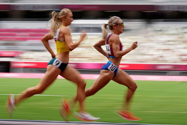 Elle Purrier St. Pierre leading Jessica Hull of Australia in a heat of the 1,500-meter race in Tokyo on Monday - AP PHOTO/MATTHIAS SCHRADE