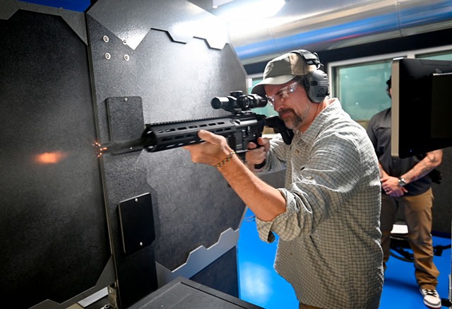 Kevin McCallum firing a Heckler & Koch rifle - JEB WALLACE-BRODEUR