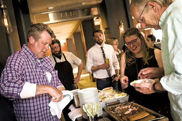 John Brawley shucking oysters - COREY HENDRICKSON