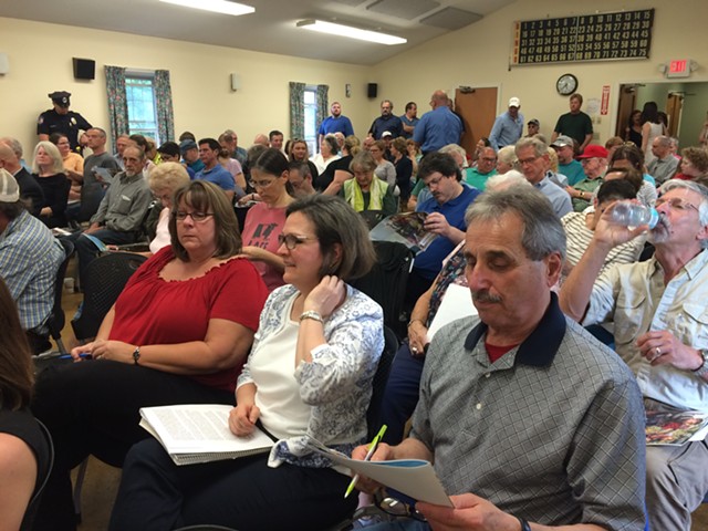 More than 100 people crowd a Rutland Board of Aldermen meeting. - MARK DAVIS