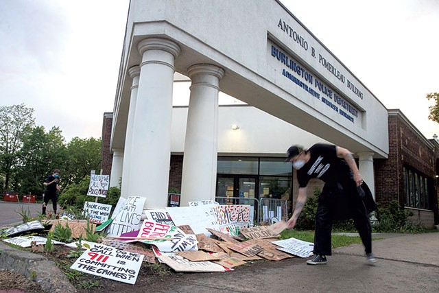 Protesters leaving signs outside the Burlington Police Department after rally last year - JAMES BUCK