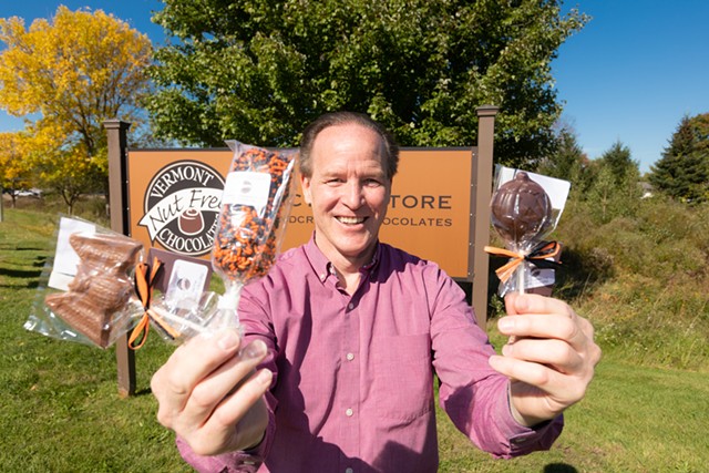 Mark Elvidge, owner of Vermont Nut Free Chocolates, holds up Halloween treats at their business in Colchester - CAT CUTILLO
