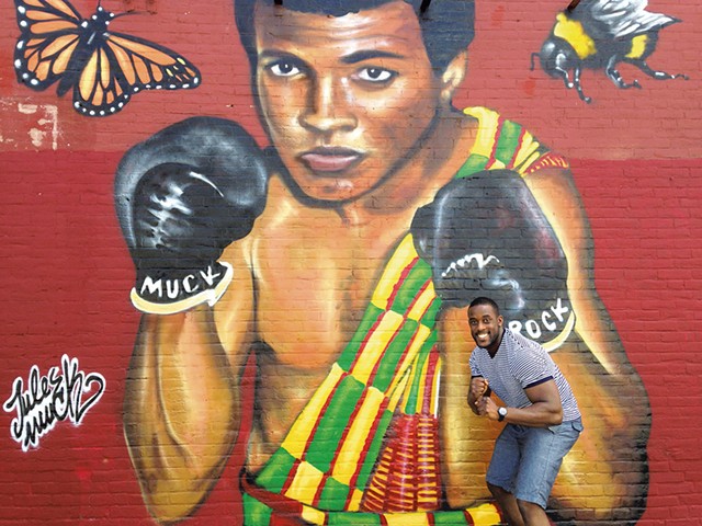 Prince Nartey Awhaitey with the mural - KEN PICARD