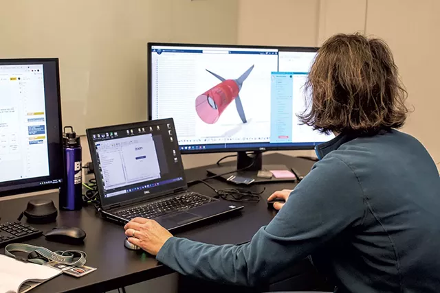 Manon Belzile working on designs - LUKE AWTRY