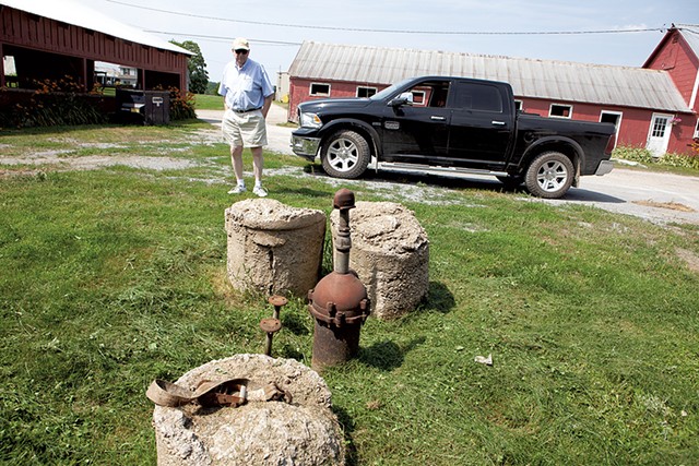John Belter by the contaminated well on his South Burlington farm in 2019 - FILE: KEVIN MCCALLUM ©️ SEVEN DAYS