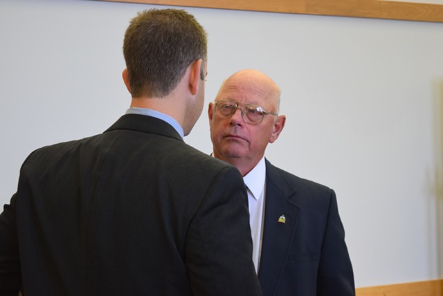 Sen. Norm McAllister, right, confers with attorney Brooks McArthur in court Monday. - TERRI HALLENBECK