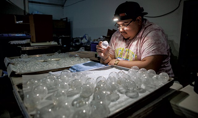 Sebastian Govoni inspecting spheres at AO Glass - BRIAN MACDONALD