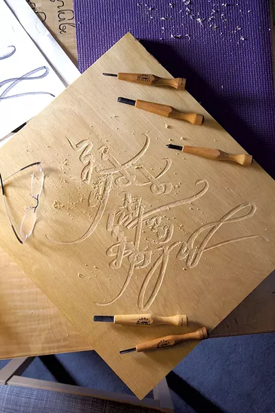 A carving from 2014 that says "Happy New Year" in Mongolian - FILE: MATTHEW THORSEN ©️ SEVEN DAYS