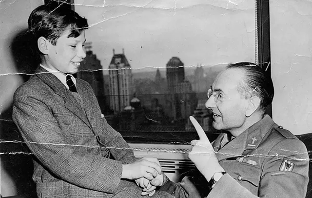 Henry Weinstock (left) with Édouard Froidure, the Catholic priest who baptized him, in 1946 - COURTESY