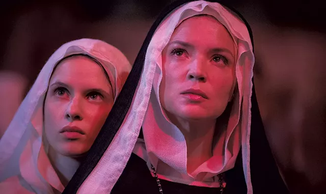 Daphne Patakia (left) and Virginie Efira in Benedetta - COURTESY OF IFC FILMS