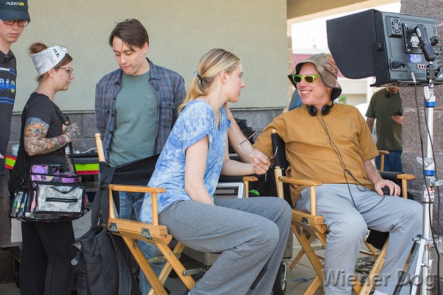 Director Todd Solondz (far right) talks with Greta Gerwig on the set of Wiener-Dog. - COURTESY OF IFC FILM