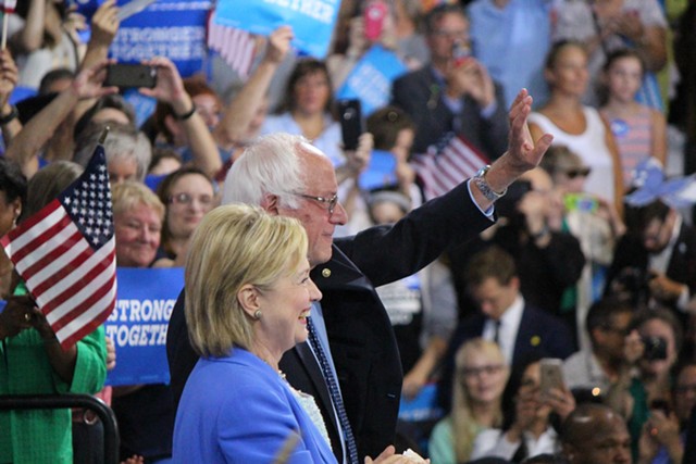 Hillary Clinton and Bernie Sanders campaign together Tuesday morning in Portsmouth, N.H. - PAUL HEINTZ