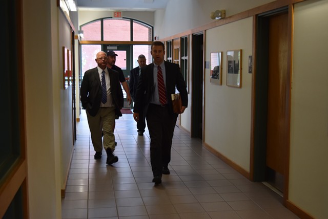 Sen. Norm McAllister (left) walks through the Franklin County court building in St. Albans with his attorney, Brooks McArthur, on Monday. - TERRI HALLENBECK
