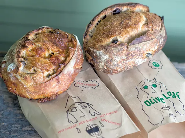 Loaves of freshly baked bread by Wren Kitz - DARIA BISHOP