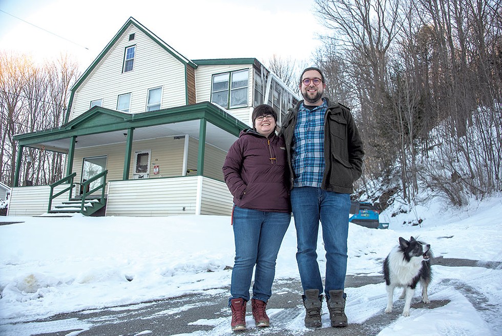 Taryn Haas and Garret Blank with their dog, Pippin, in front of their Barre home - JEB WALLACE-BRODEUR