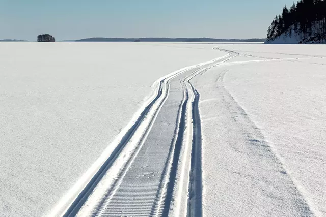 Snowmobile trail on a frozen lake - &copy; MPS197 | DREAMSTIME