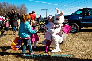 The Easter Bunny greets kids at the Milton Park and Rec egg hunt. - COURTESY OF MILTON PARKS AND REC