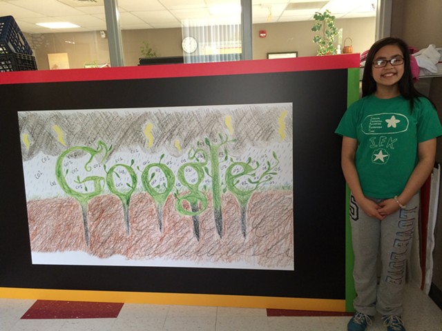 Penny Ly with a blown-up version of the Google logo she designed.