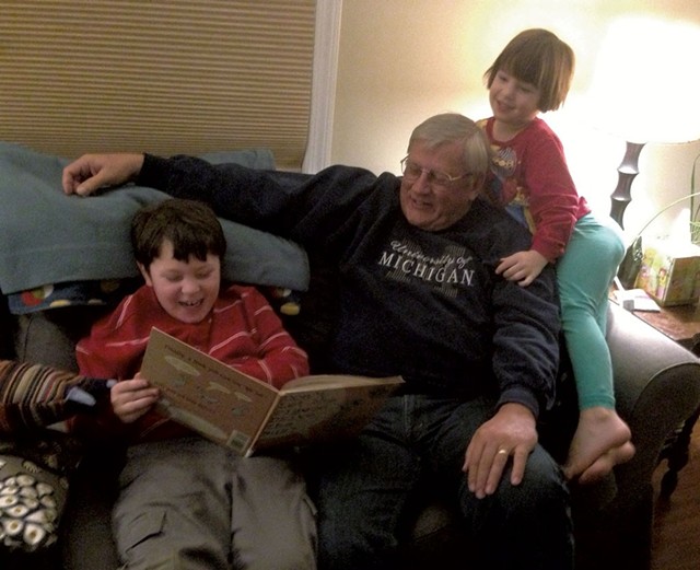 Grandpop Mike Resmer reads to Graham and Ivy