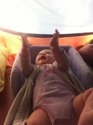 Elise plays in her co-sleeper - TRISTAN VON DUNTZ
