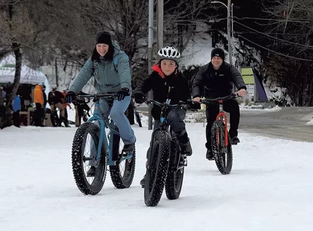 The Garbach family tries out fat bikes at the Überwintern festival in Stowe - TRISTAN VON DUNTZ