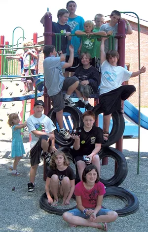 Campers pose on a play structure - COURTESY OF OCCC
