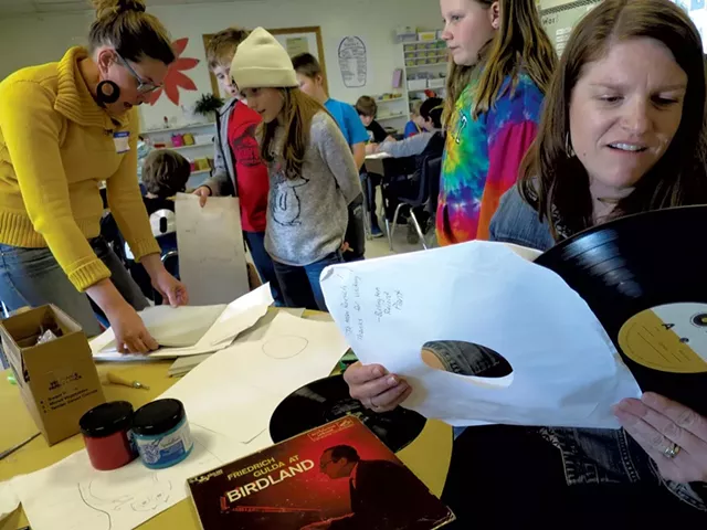 Carin Lilly (left) and Shannon Roesch (right) help students with block printing - MATTHEW THORSEN