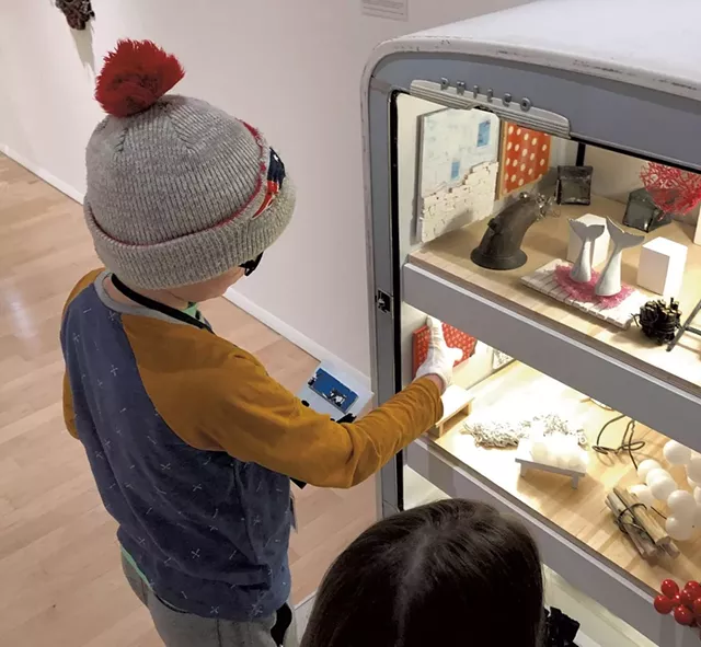 Henry checks out Matt Neckers' open refrigerator - HEATHER POLIFKA-RIVAS