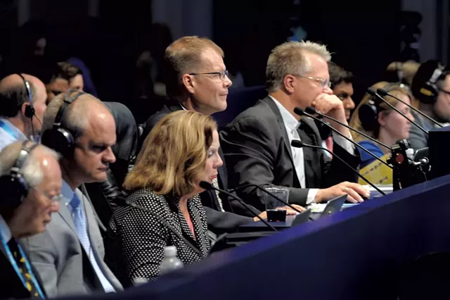 Dr. Bailly (center) pronouncing at last year's Scripps National Spelling Bee - COURTESY OF MARK BOWEN/SCRIPPS NATIONAL SPELLING BEE