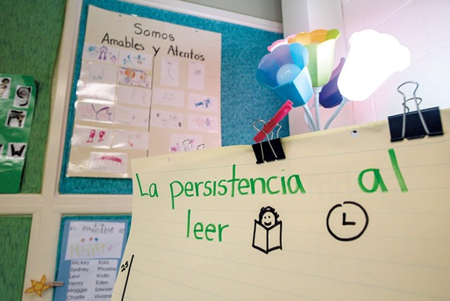 Signs in Spanish adorn Sylvan Ross' Spanish immersion kindergarten classroom at Jericho Elementary School - GLENN RUSSELL