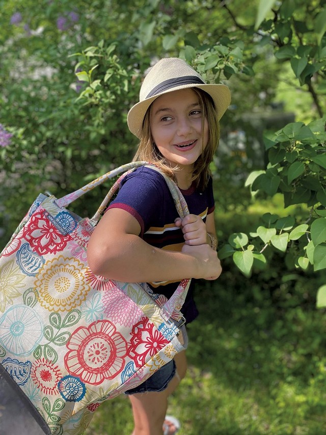 Sophie carrying her family's picnic basket - TRISH VAN VLIET