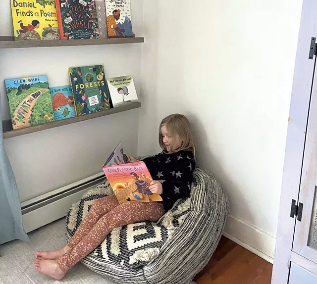 Meredith's daughter reading One Plastic Bag - MEREDITH BAY-TYACK