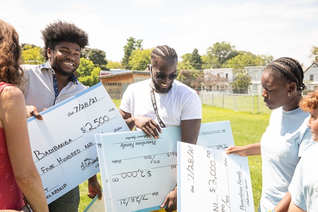 College students Bienfait Badibanga (left) and Tumba Felekeni (center) were awarded scholarships - CAT CUTILLO