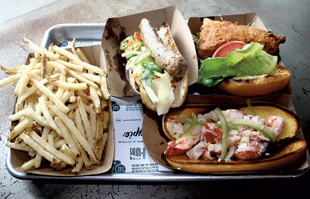 French fries, the Vietnamese sausage, fried chicken sandwich and lobster roll at Honeypie - SUZANNE PODHAIZER