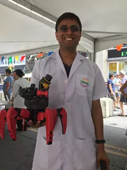 Nirav Shah, of Burlington’s Laboratory B, with Fluffy the laser-shooting robot