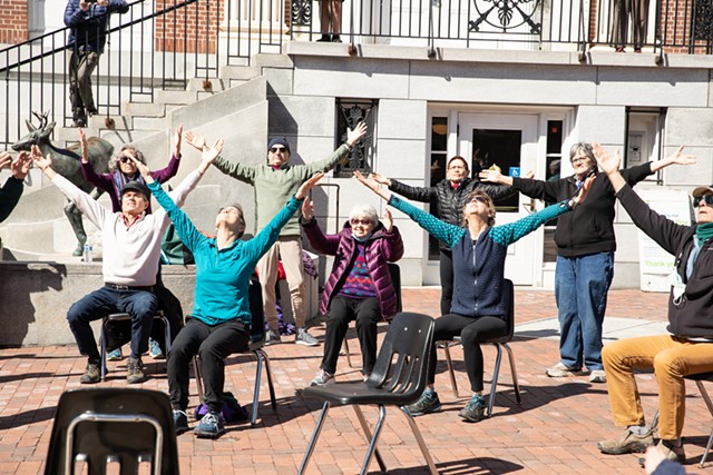 The Flynn's Movement for Parkinson's and wellness class performs on Church Street. - CAT CUTILLO