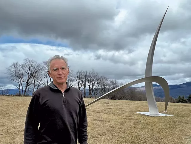 Christopher Curtis with his sculpture "That Place in the Stars" - COURTESY