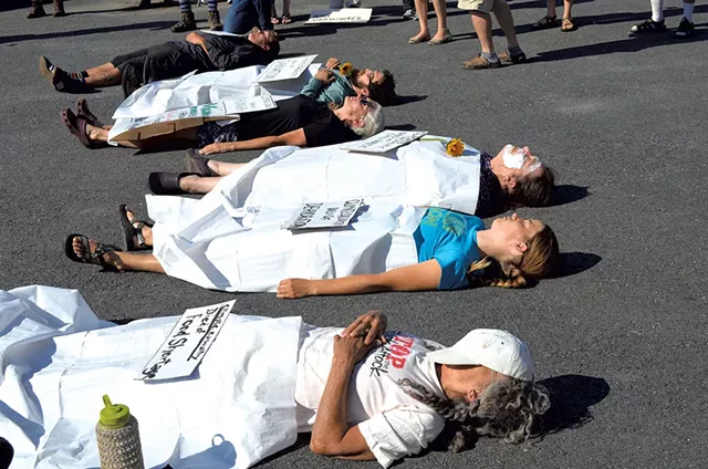 Protesters staging a "die-in" - ALICIA FREESE
