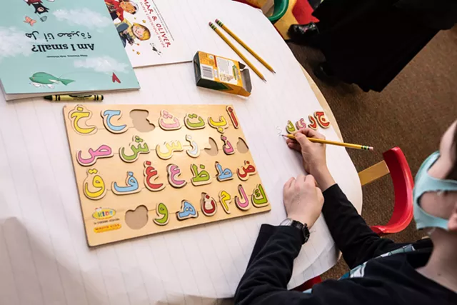Kids learned to write their names in Arabic during an Arabic story hour in Winooski this spring - CAT CUTILLO