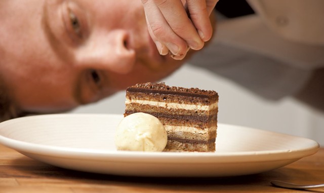 Andrew LeStourgeon completes an opera cake at Hen of the Wood - FILE PHOTO: MATTHEW THORSEN