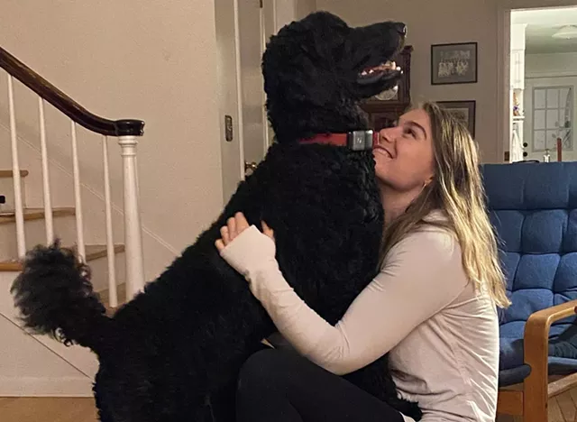 Emma Rose McCadden and her service dog, Jasper - COURTESY