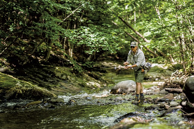 Jamie Eisenberg fly-fishing at a creek in Underhill - OLIVER PARINI