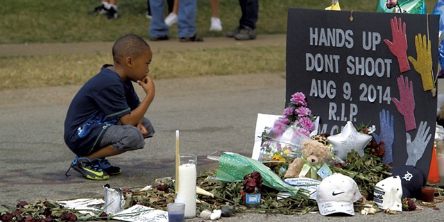 A young boy at the Michael Brown memorial site in Ferguson, Mo. - COURTESY OF VANISH FILMS