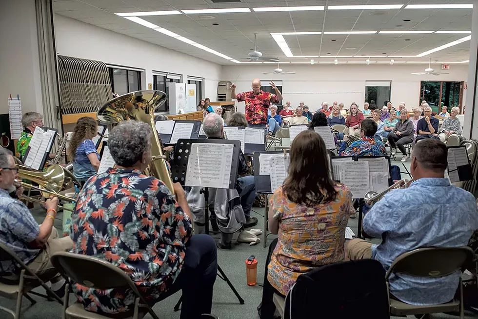 Residents listening to the Milton Community Band in the activity center at Williston Woods - DARIA BISHOP