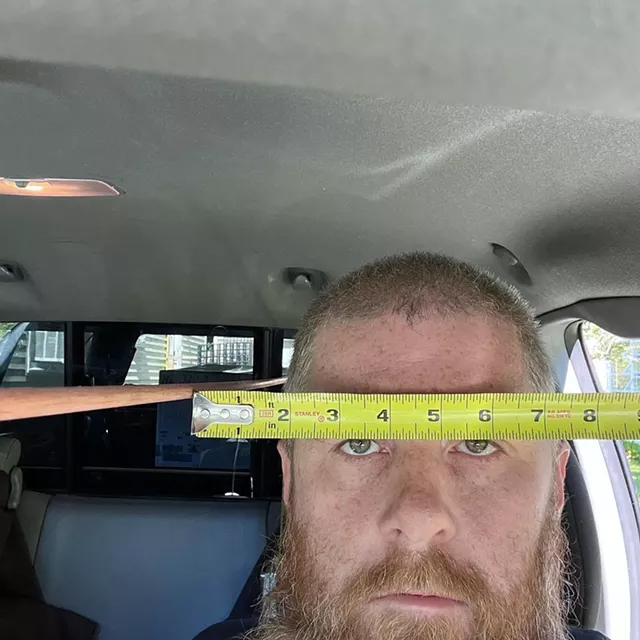 Colin Burch next to a rod he used to try to trace the path of a police officer's bullet - COURTESY OF COLIN BURCH