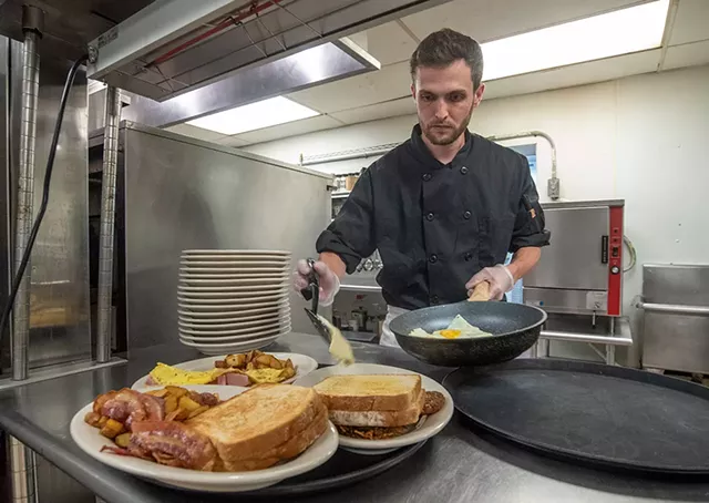 Larry Dillard cooking breakfast at the Goddard Café in Plainfield - JEB WALLACE-BRODEUR
