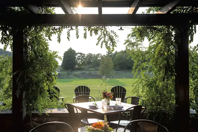 Outdoor dining area with a view - DARIA BISHOP